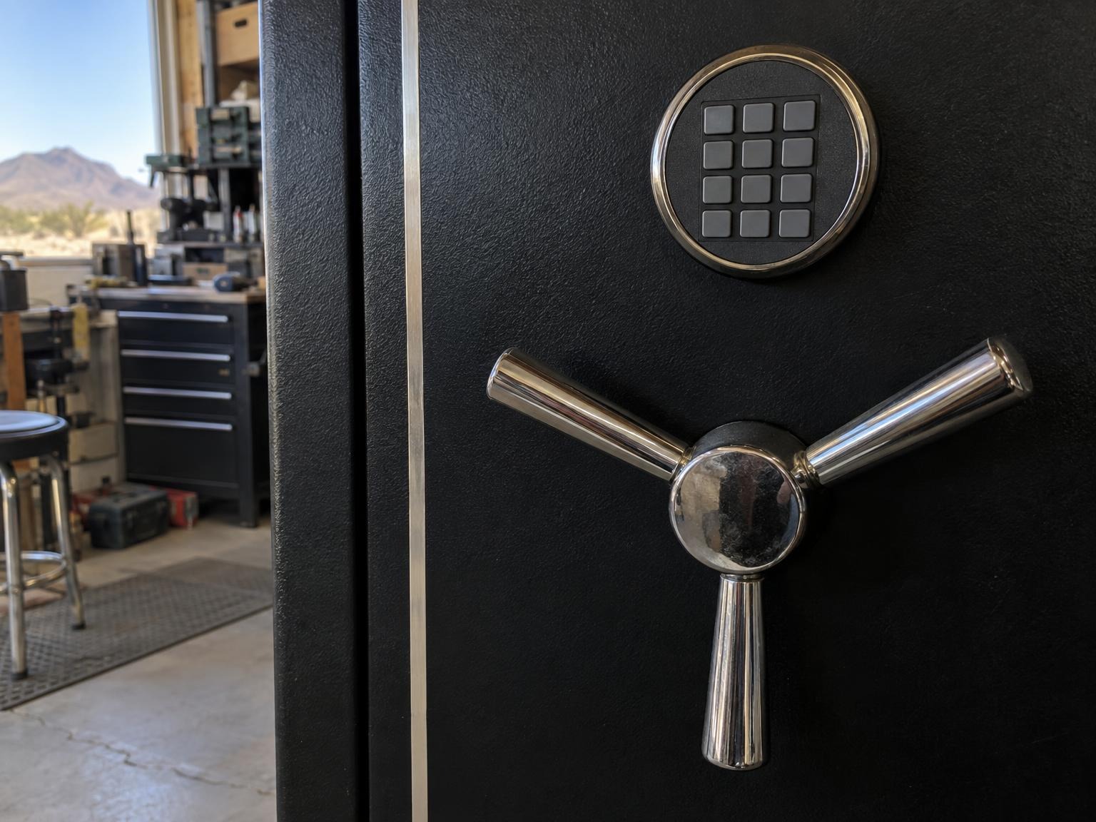 Keypad and spoke handle on a black gun safe